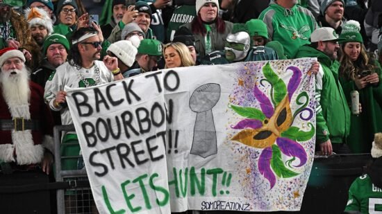 Eagles fans take to streets to celebrate team’s NFC title win; fan drops from light pole