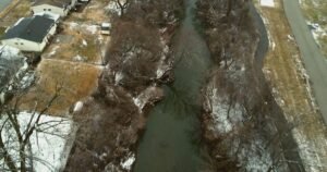 They didn’t know their backyard creek carried nuclear waste. Now, they’re dying of cancer.