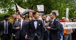 Tuxedos, luxury SUVs and protesters