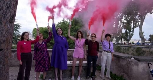 Activists use pink smoke to call for more women in the Catholic church