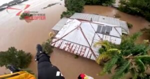Australian woman rescued from floodwaters