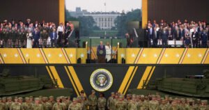 Trump presides over a military parade amid turmoil at home and abroad