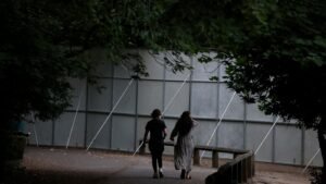 Huge steel fences erected to stop ticketless fans from watching Oasis concert | Ents & Arts News