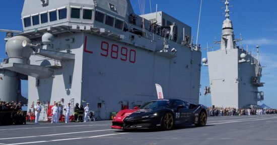 Man in a Ferrari on an aircraft carrier attempts to set record for fastest car driven on a boat