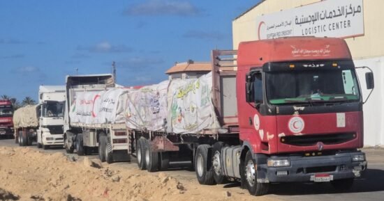 Aid trucks prepare to enter Gaza as Israel says ceasefire is in effect