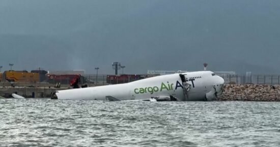 Two ground staff killed at Hong Kong airport after cargo plane skids off runway