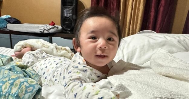 Baby defies all odds after growing outside his mom’s womb