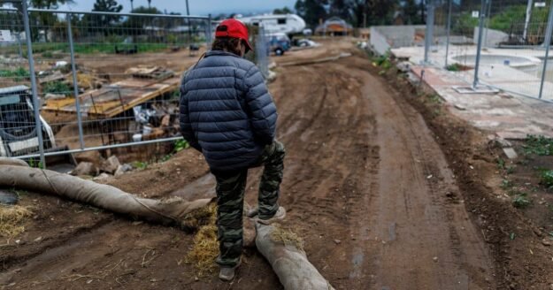California slammed by torrential rain as residents prep for flooding