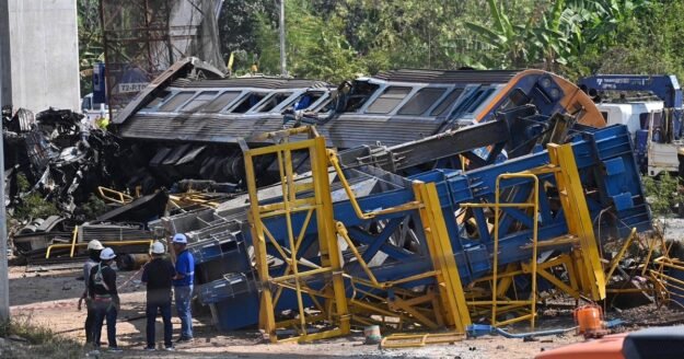 Crane falls onto moving train in Thailand, killing at least 22 in fiery derailment