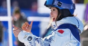 Skier Eileen Gu sports a personalized, detail-studded ski suit at Milano Cortina Olympics