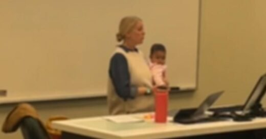 Professor holds college student’s baby during class