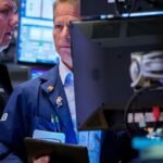 Dow slides nearly 800 points as AI and tariff risks rattle investors