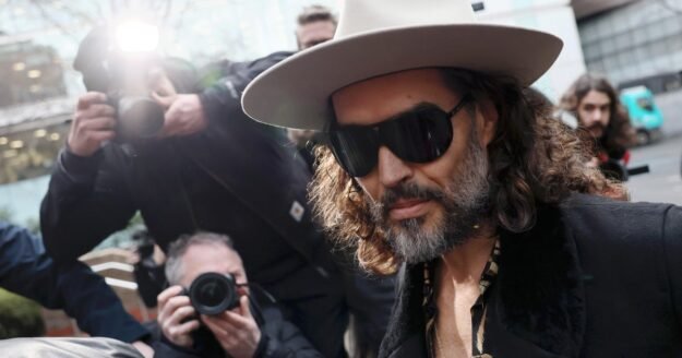 Russell Brand, bible in hand, pleads not guilty to new rape and sexual assault charges