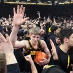 Iowa court storm leads to coach smacking fan’s phone; apology issued by Hawkeyes