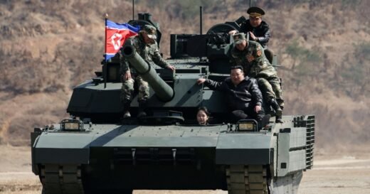 North Korean leader Kim and his daughter ride a tank together during army training