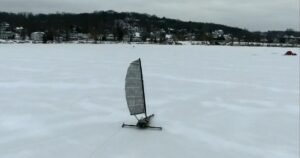 Setting sail on iceboats across a frozen lake in Wisconsin
