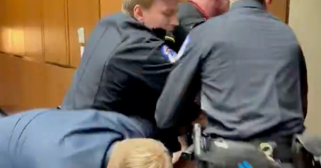 GOP senator joins police in ejecting anti-war protester from Capitol Hill hearing