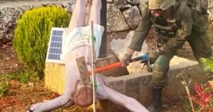 Israeli soldier strikes Jesus statue in Lebanon, photo shows