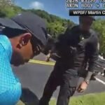 Body camera video of Tiger Woods arrest shows golfer being handcuffed after Florida crash