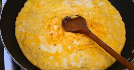 Not butter or milk – add 2 things to scrambled eggs for creamy results