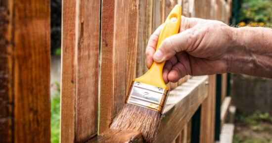 Woman fumes as neighbour paints fence without permission