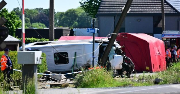 Train crashes into school minibus in Belgium, with unconfirmed reports of fatalities