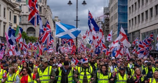 Thousands hit London streets for “Unite the Kingdom” march organized by far-right activist Tommy Robinson