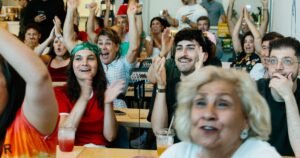 Iran diaspora watches World Cup game with protests, support