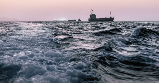 Oil tankers pass the Strait of Hormuz despite Iran threats as traffic slowly picks up and oil prices fall