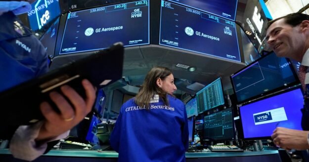 Dow soars nearly 900 points as Wall Street bets on Iran peace deal