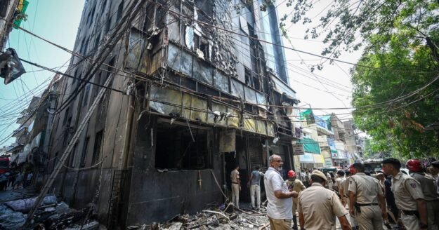 Fire tears through hotel in India’s capital in Delhi, killing at least 21 people as some jump from windows