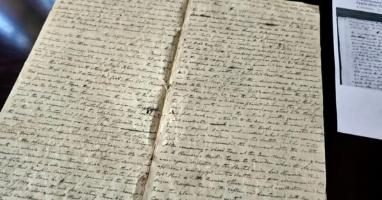 Volunteers deciphering first-person Revolutionary War accounts written in cursive