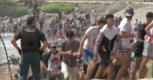 Thousands of migrants force their way into Spain’s Ceuta territory in North Africa