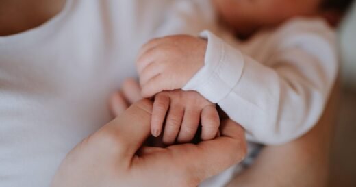 The measles outbreak is “slowing.” A newborn’s family still can’t meet her.