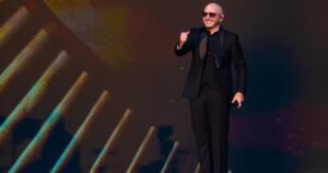 Pitbull sets Guinness World Record for largest gathering of people wearing bald caps