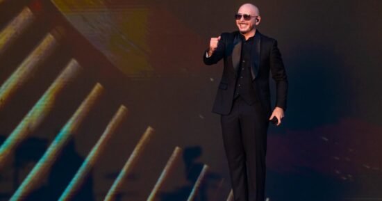 Pitbull sets Guinness World Record for largest gathering of people wearing bald caps