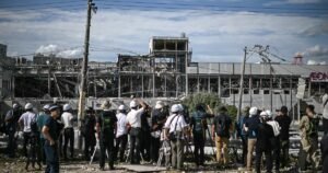 Japan earthquake death toll hits 18 as teams race to find people missing in damaged mall and paper factory