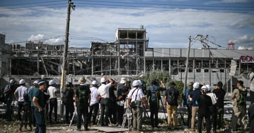 Japan earthquake death toll hits 18 as teams race to find people missing in damaged mall and paper factory