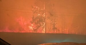 Fast-moving wildfire in western Canada forces more than 20,000 people to evacuate