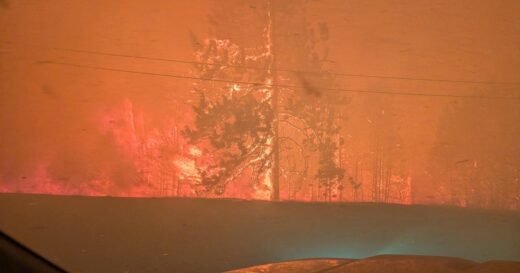 Fast-moving wildfire in western Canada forces more than 20,000 people to evacuate