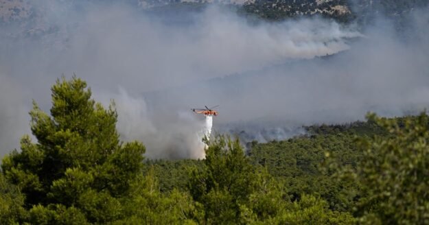 Firefighting helicopters collide midair in Greece as wildfires rage across Europe
