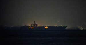 USS Lincoln sails past Singapore on its way to the Middle East after grueling 9-month deployment