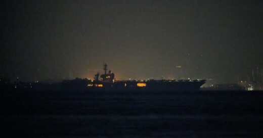 USS Lincoln sails past Singapore on its way to the Middle East after grueling 9-month deployment
