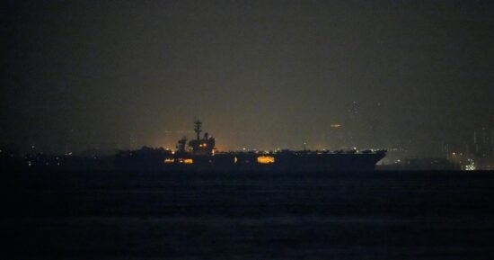 USS Lincoln sails past Singapore on its way to the Middle East after grueling 9-month deployment