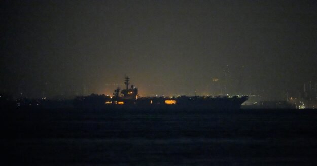 USS Lincoln sails past Singapore on its way to the Middle East after grueling 9-month deployment