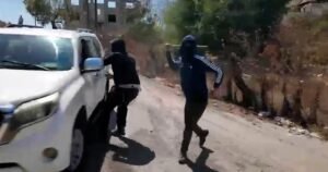 Palestinian woman and NBC News team attacked by masked Israeli settlers