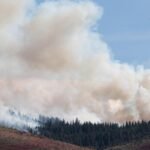 Firefighters battle flames and smoke near Reno fueled by drought and wind