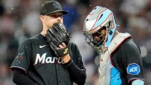 Marlins outfielders collide and knock ball over wall for a home run