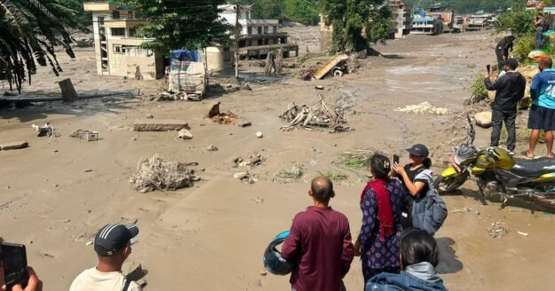 Flash flood tears through Nepal, killing scores and leaving almost 400 tourists missing, including Americans