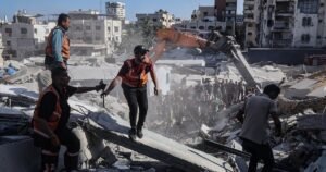 War-damaged Gaza building housing displaced Palestinian families collapses, killing at least 14 people